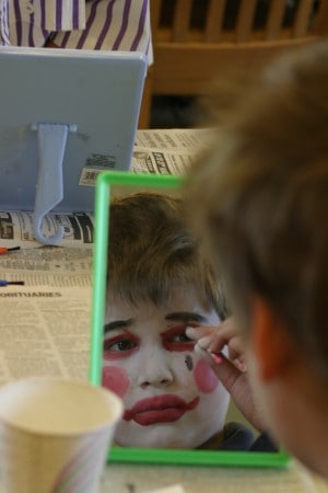 A student puts on his clown face as part of an Albert Alter in-school residency.