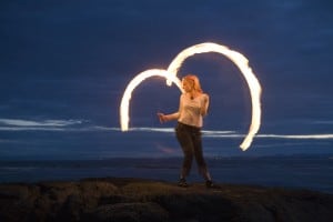 In her not-so-secret other life, Rachel is also a professional fire performer. Photo credit: Tim Summers